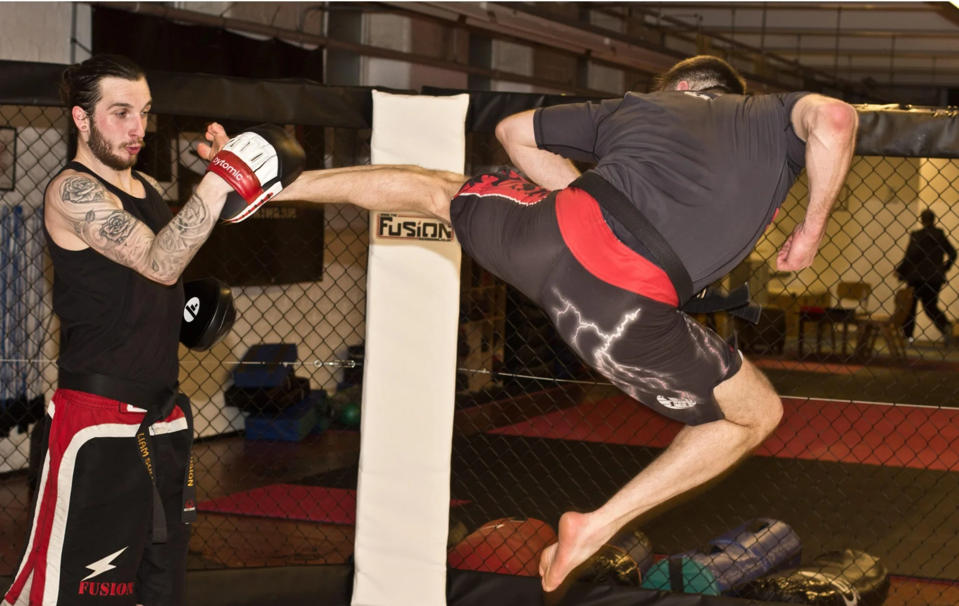 Coach-demonstrating-jumping-kick